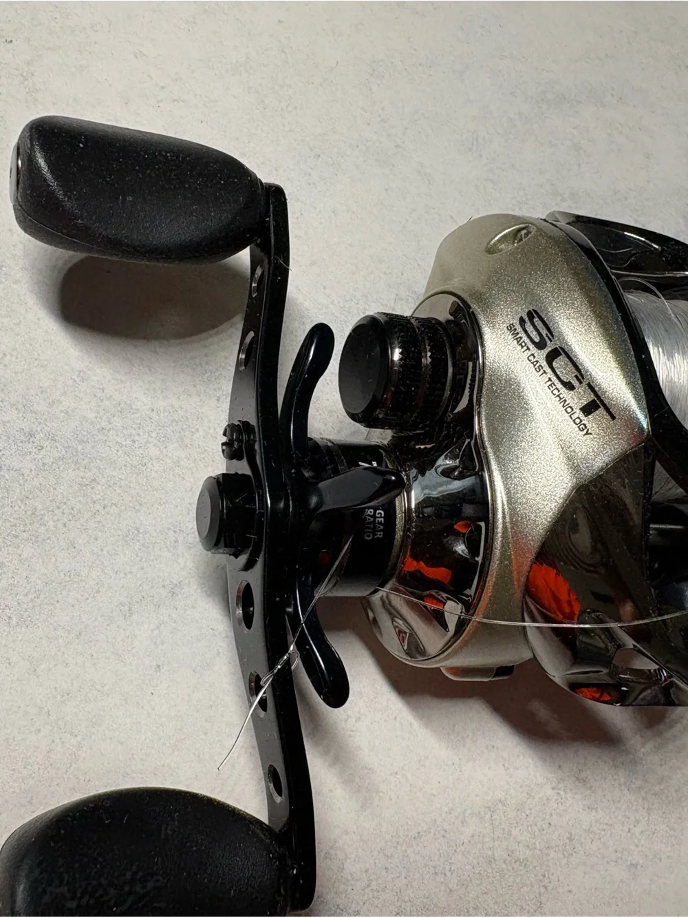 Bass Pro Shops Enigma Smart Cast Reel - Black and Gold - Picture 3 of 10